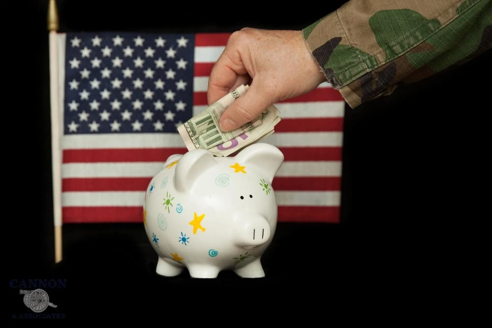 Military member putting money into a piggy bank. Military retirement concept.
