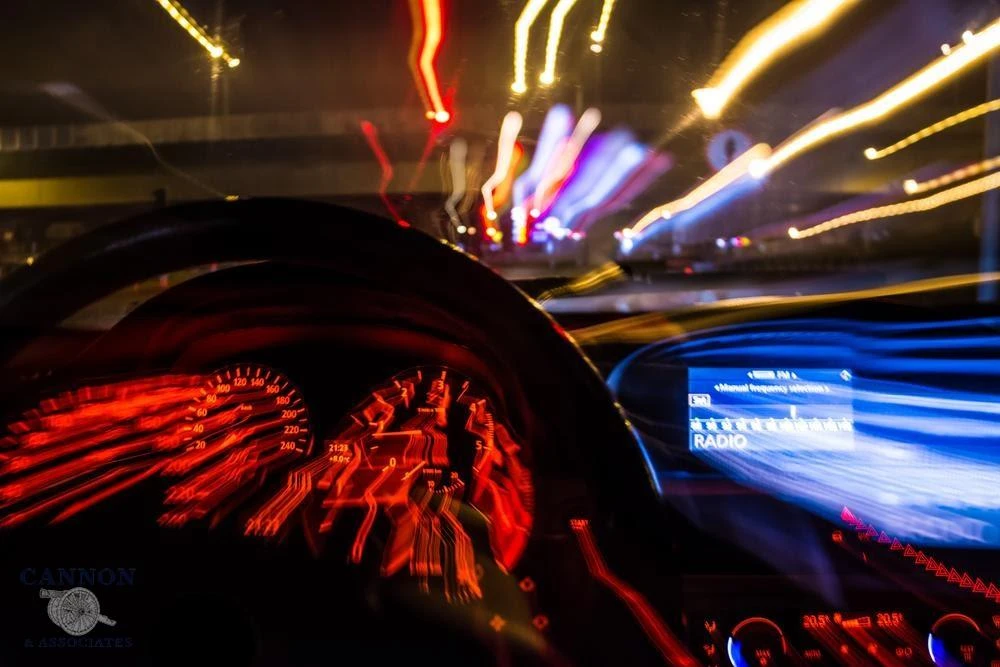 Blurred lights flying by in a car.
