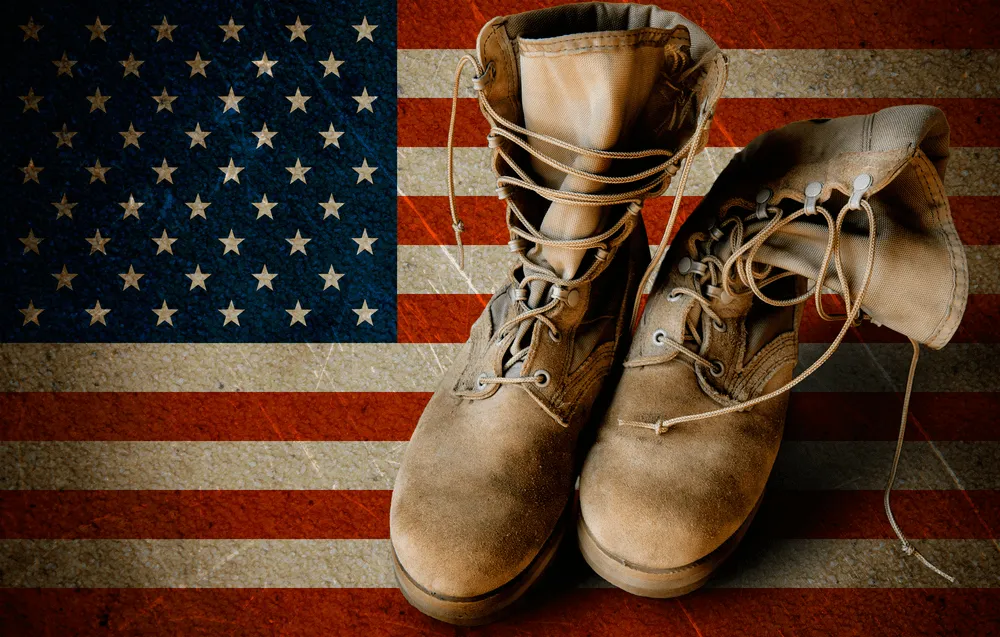 Military boots on a flag.