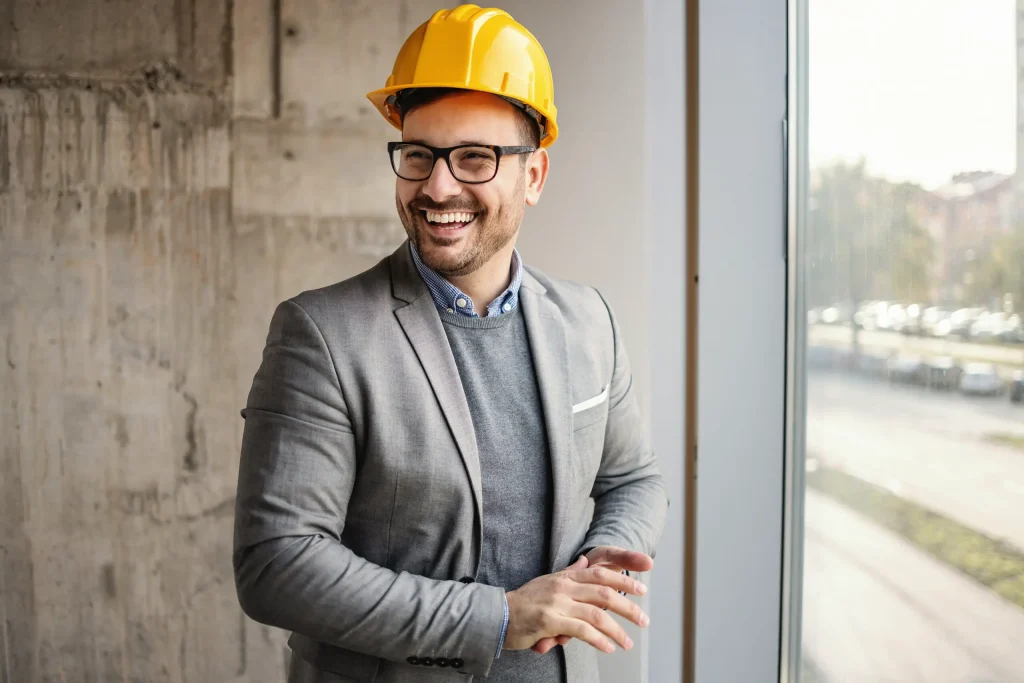 Smiling architect in suit at job site. If you have a criminal record and are ready to move on from the past, contact our Oklahoma City expungement lawyers today. 