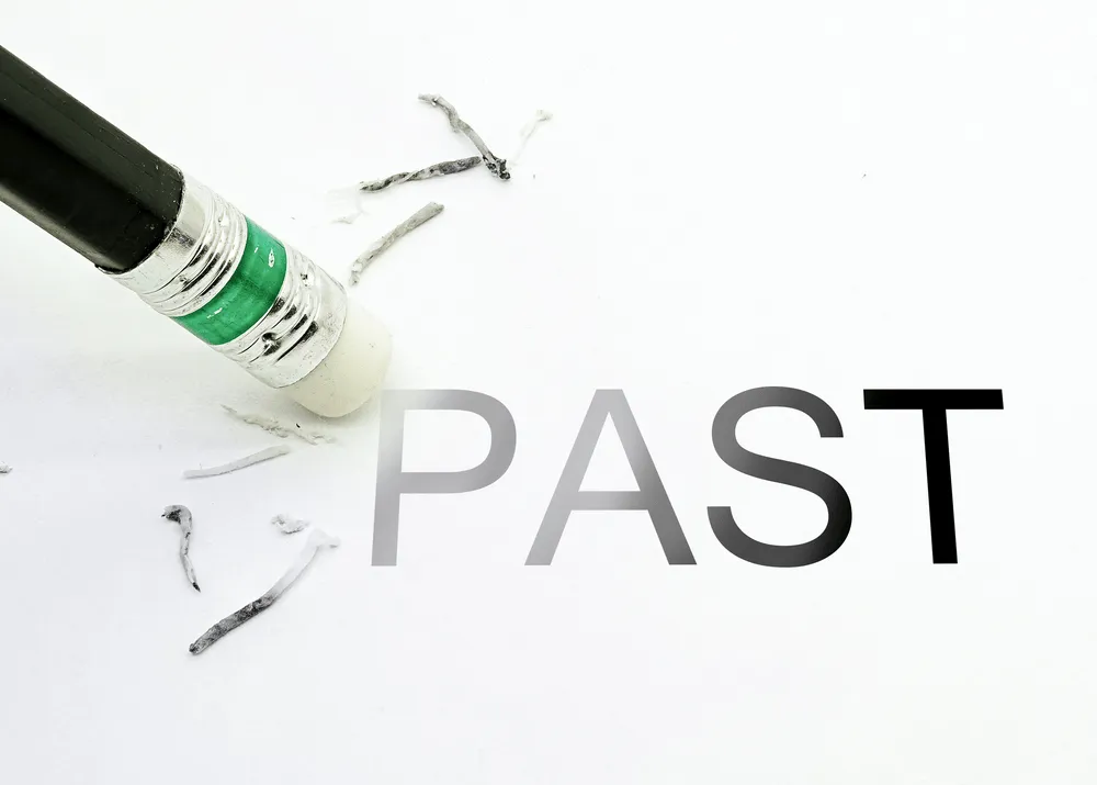 Pencil Erasing the word Past.