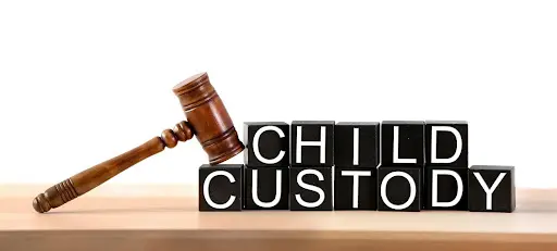 Child custody blocks with gavel.