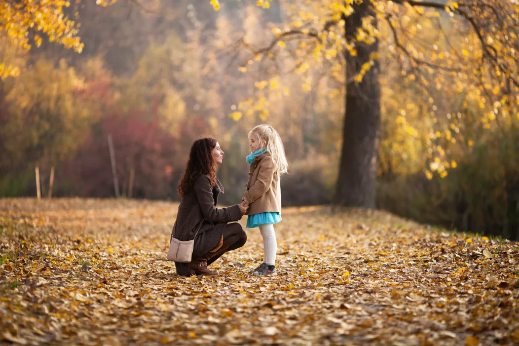 Loving mother bent down and having serious conversation with daughter. The divorce lawyers at Cannon & Associates can help you modify court orders such as child custody and support. 