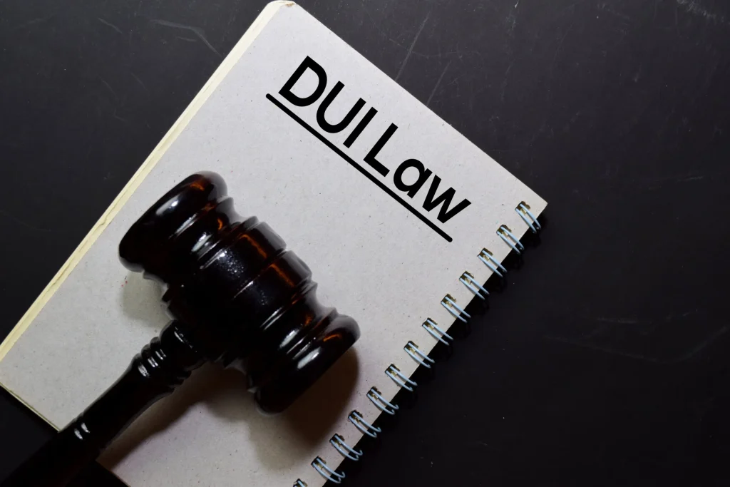 A justice gavel on a notebook with DUI Law printed on it. Our Oklahoma City, OK DUI lawyers will assist you in understanding your rights if you get pulled over for a DUI.