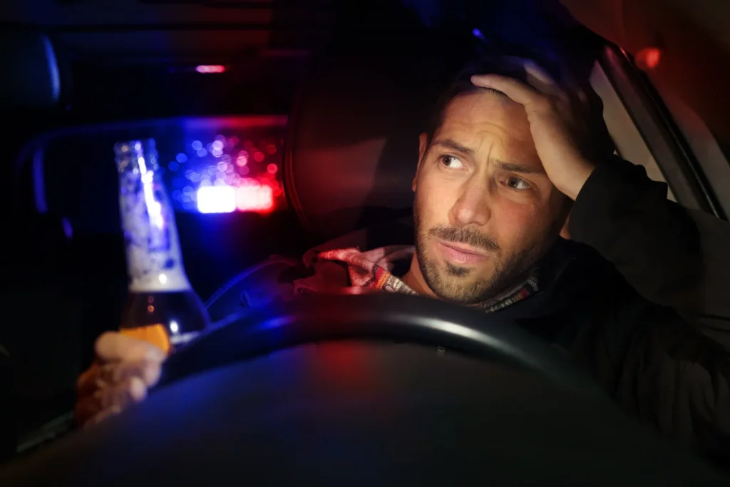 a man being pulled over by the police for DUI