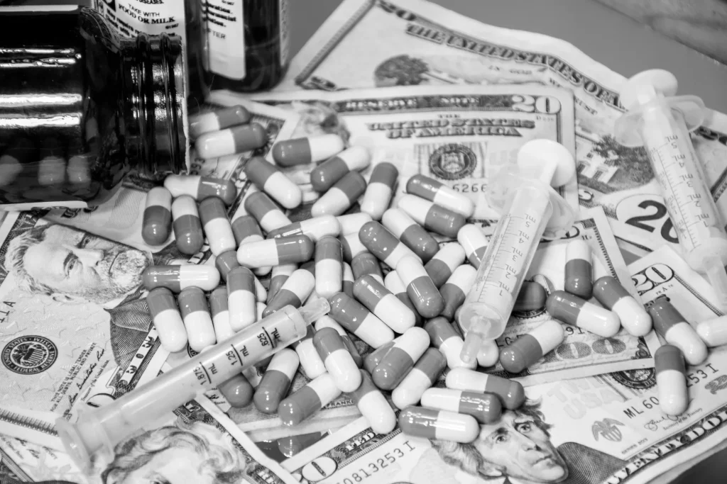 A pile of money and pills.