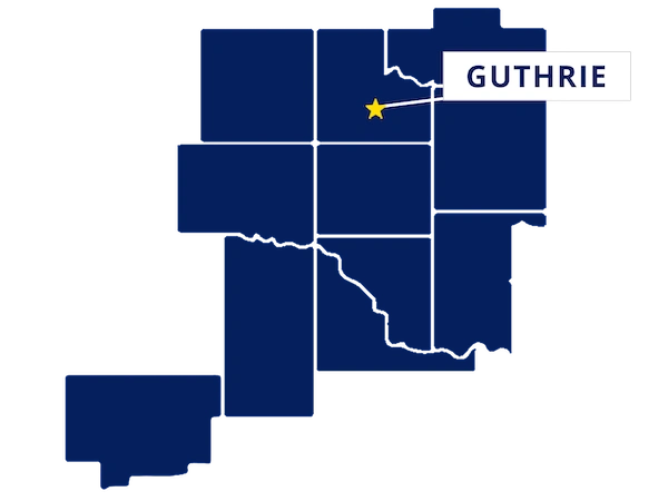 Map highlighting Guthrie, Oklahoma with a yellow star and label, surrounded by outlined counties in dark blue.