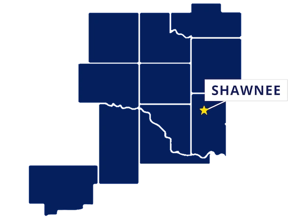 Map highlighting Shawnee, Oklahoma with a yellow star and label, surrounded by outlined counties in dark blue.