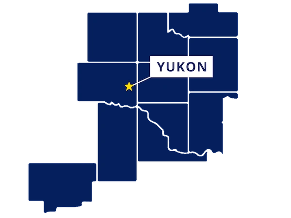 Map highlighting Yukon, Oklahoma with a yellow star and label, surrounded by outlined counties in dark blue.