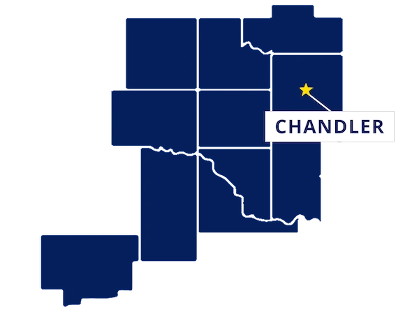 Map highlighting Chandler, Oklahoma with a yellow star and label, surrounded by outlined counties in dark blue.