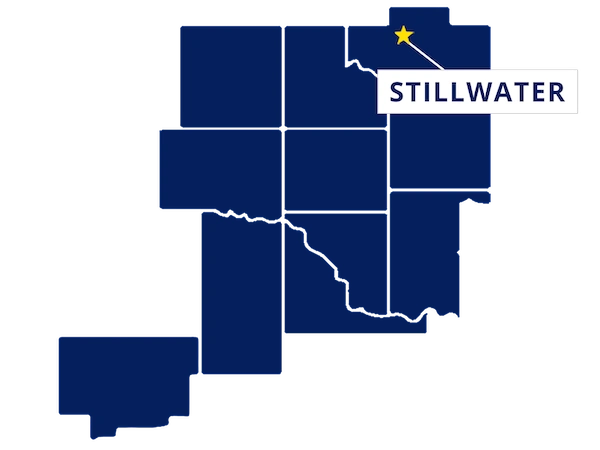 Map highlighting Stillwater, Oklahoma with a yellow star and label, surrounded by outlined counties in dark blue.