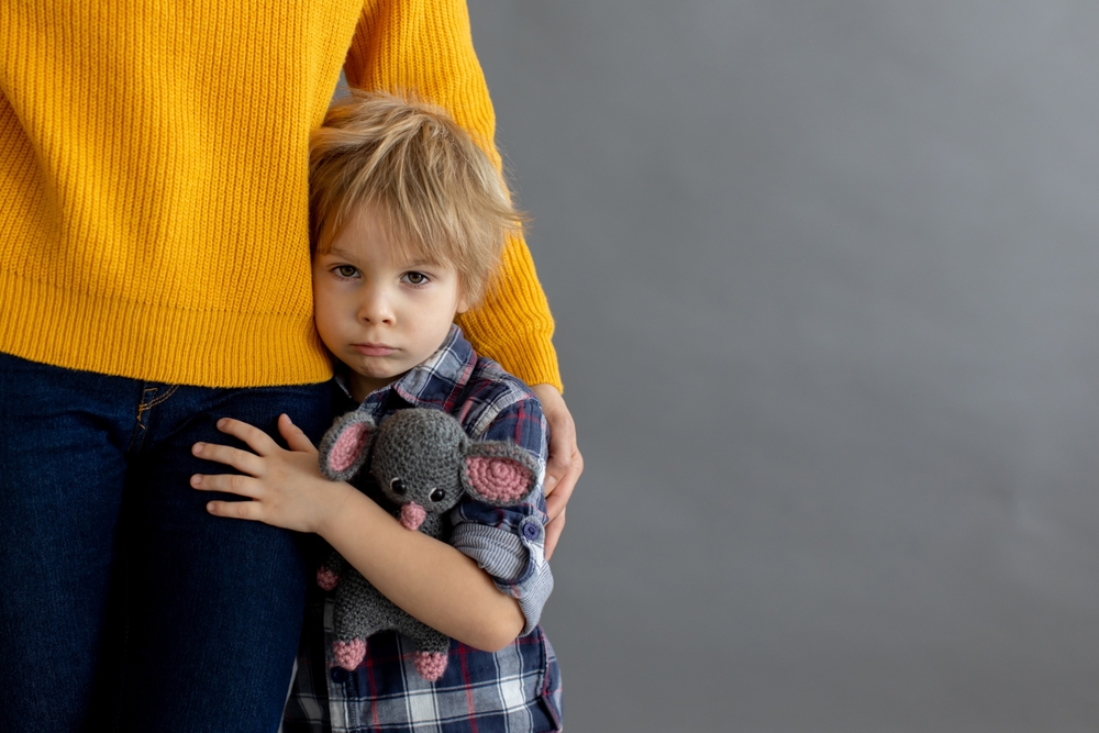 Sad child with parent